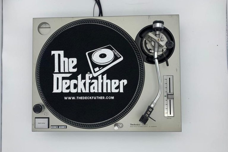 Turntable with "The Deckfather" logo and website URL displayed prominently.